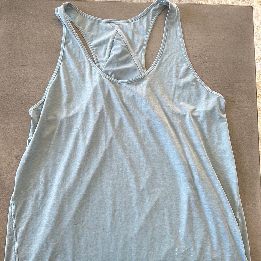 Lululemon flowy workout tank pale blue heather color size 10. Would fit M/L
